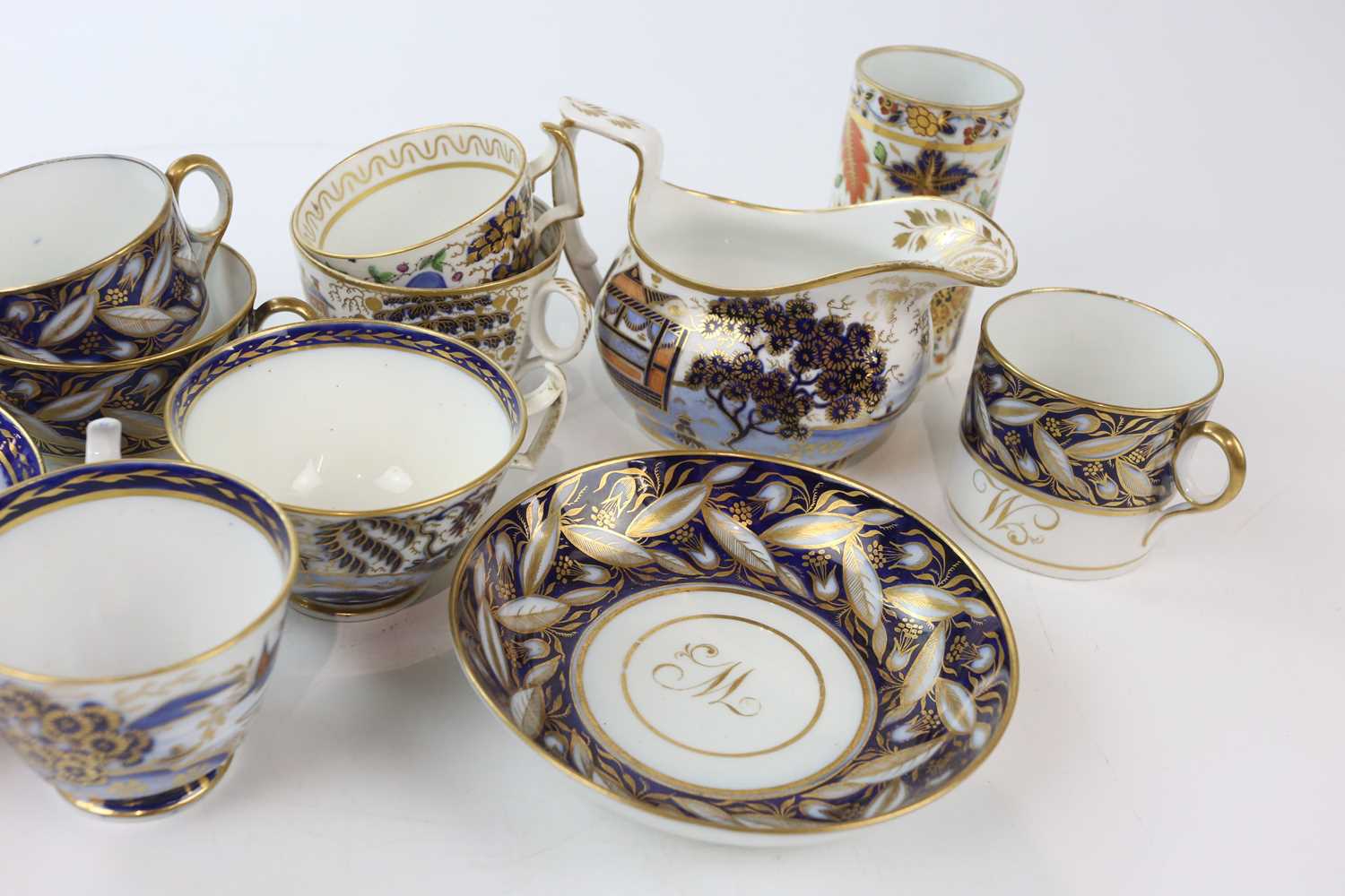 NEW HALL AND OTHERS; a collection of early 19th century Imari tea wares, comprising a trio - Bild 3 aus 4