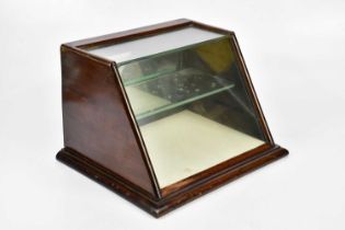 A late Victorian table top cabinet with mirror back folding door and single fixed shelf, width 39cm,