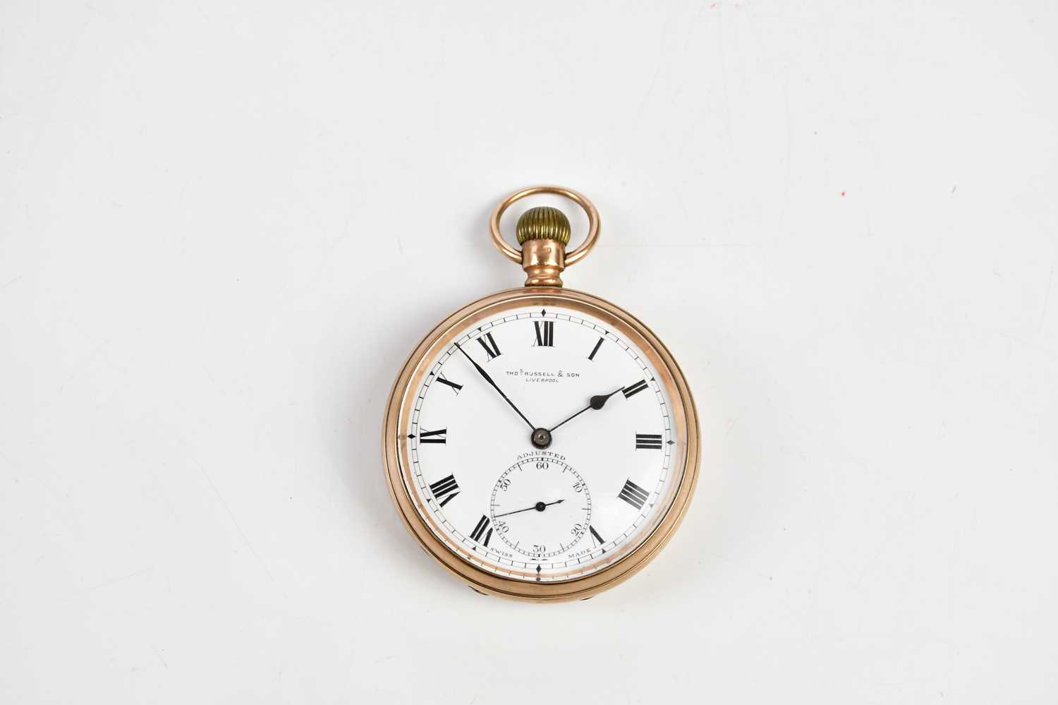 A 9ct yellow gold crown wind open face pocket watch with Roman numerals to the white enamel dial,