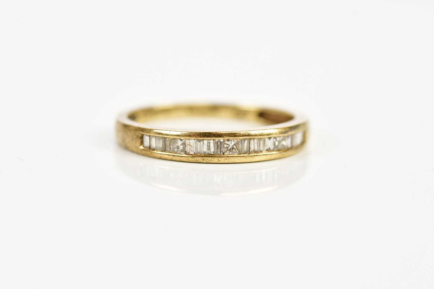 A 9ct gold and diamond set half eternity ring, size P, weight 1.8g