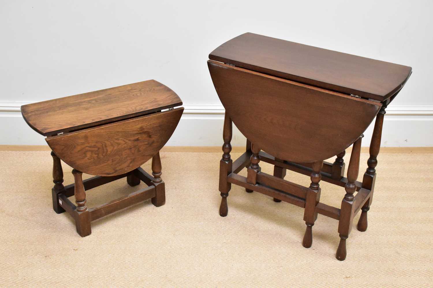 A reproduction oak drop-leaf gateleg dining table, height 68cm, and a modern oak drop-leaf coffee