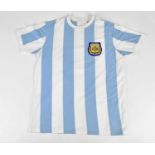 DIEGO MARADONA; a 1986 retro style Argentina football shirt, signed to the reverse. Condition