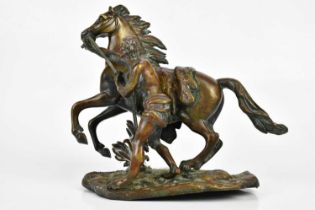 A bronzed model of a Marly horse and groom, height 23cm.