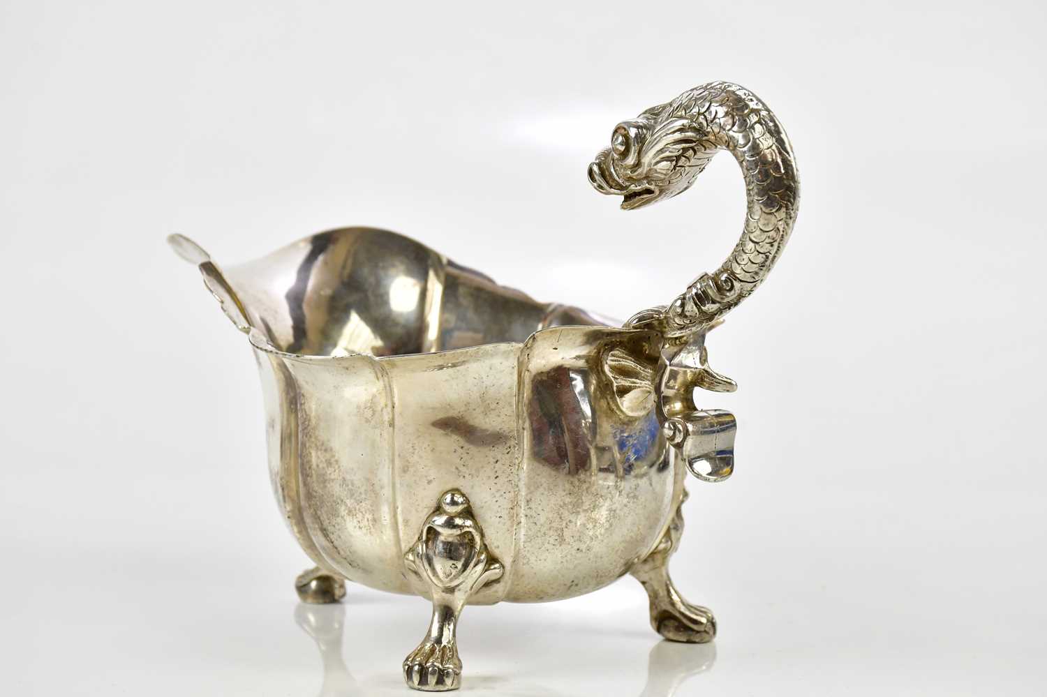 A good George III hallmarked silver sauceboat, with serpent handle and panelled body, on ball and - Image 4 of 7