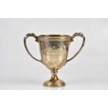 ADIE BROS LTD; a George V hallmarked silver twin handled pedestal trophy cup, inscribed 'George