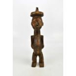 A Nkisi carved wooden Congo spirit figure, height 51cm.