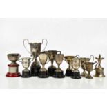 FRED H ADAMS & CO; a George V hallmarked silver twin handled pedestal trophy cup, Birmingham 1934,