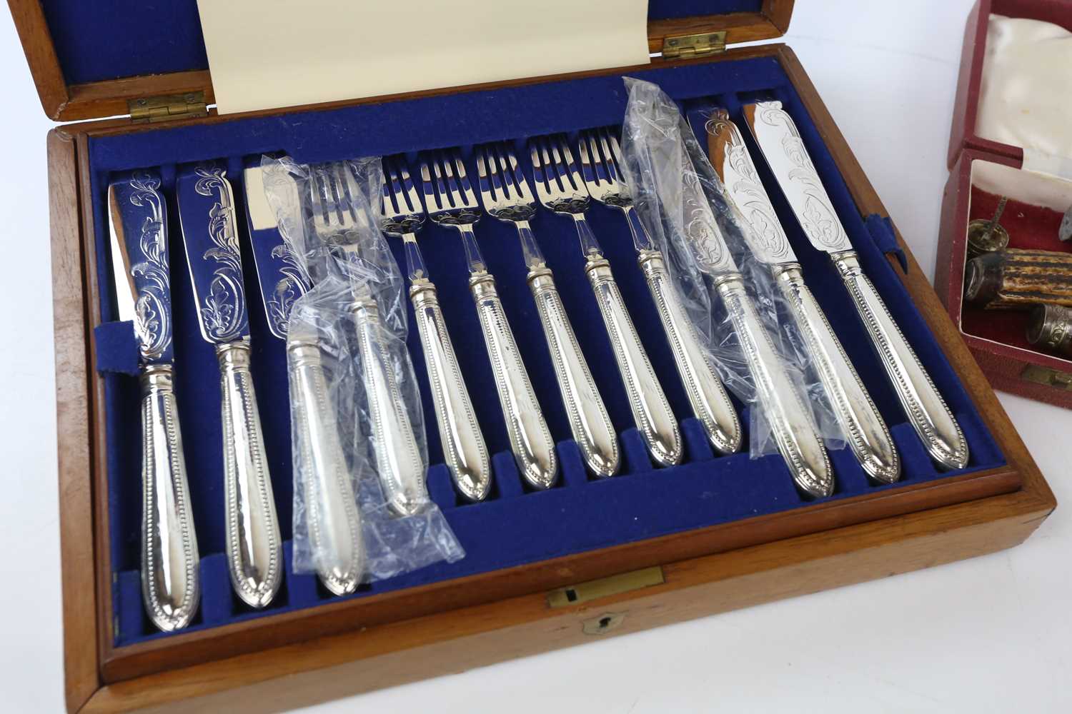 A cased set of six pairs of silver plated fish eaters, with beaded detailing, with a cased three - Image 2 of 3