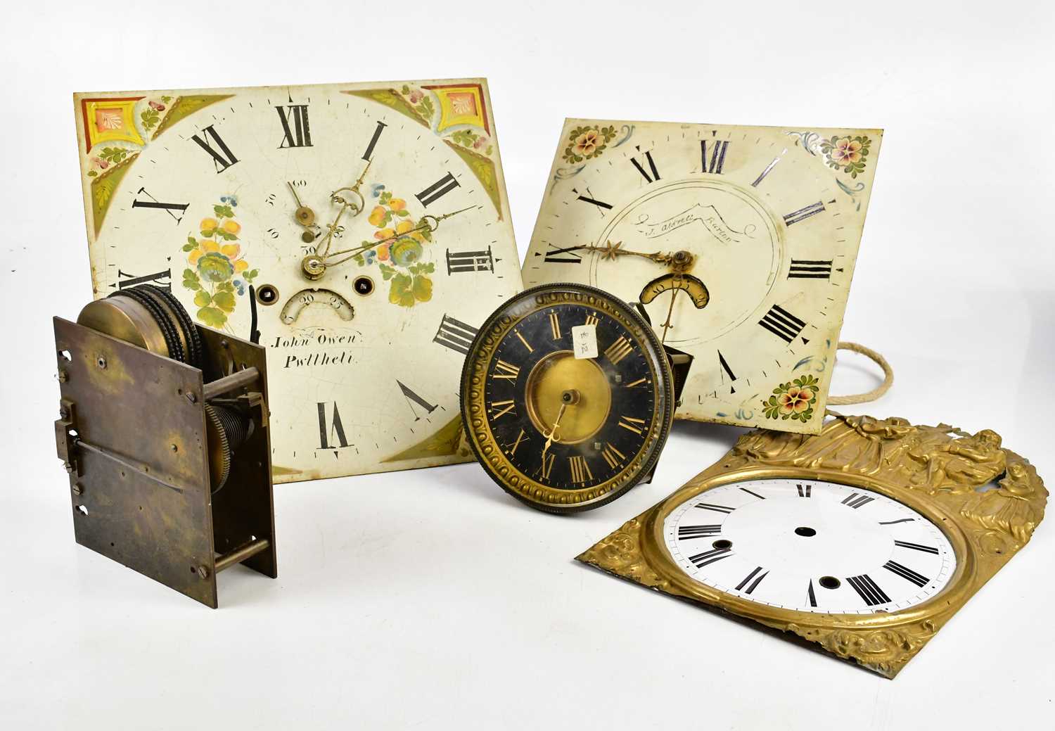 A collection of longcase clock faces, movements and parts, to include an 18th century movement,