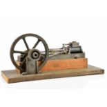 A model horizontal engine, on wooden plinth, unnamed, length 47cm. Condition Report: Main piston arm