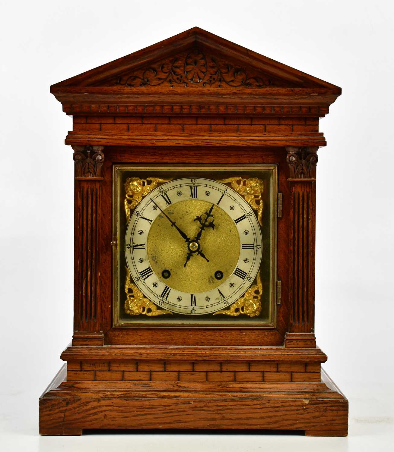 Winterhalder & Hofmeier; a late 19th century carved oak mantel clock of architectural form, the