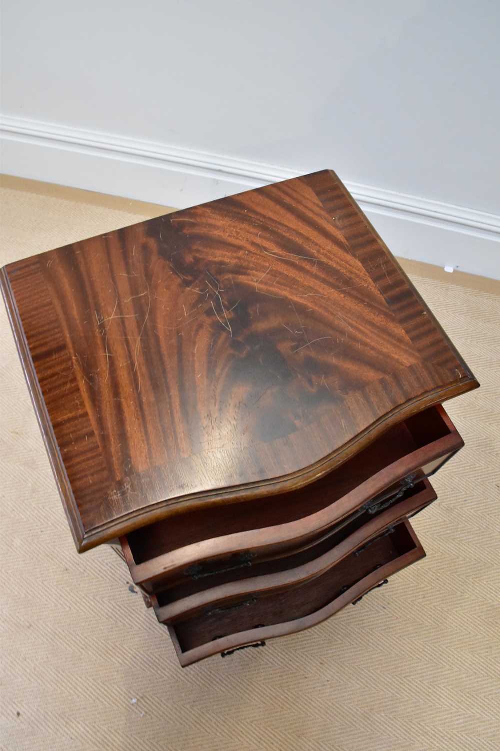 A reproduction mahogany serpentine fronted chest of four drawers, on bracket feet, height 72cm, - Image 2 of 2