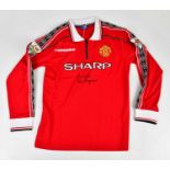 ALEX FERGUSON; a Manchester United Treble Winners signed retro style football shirt, signed to the