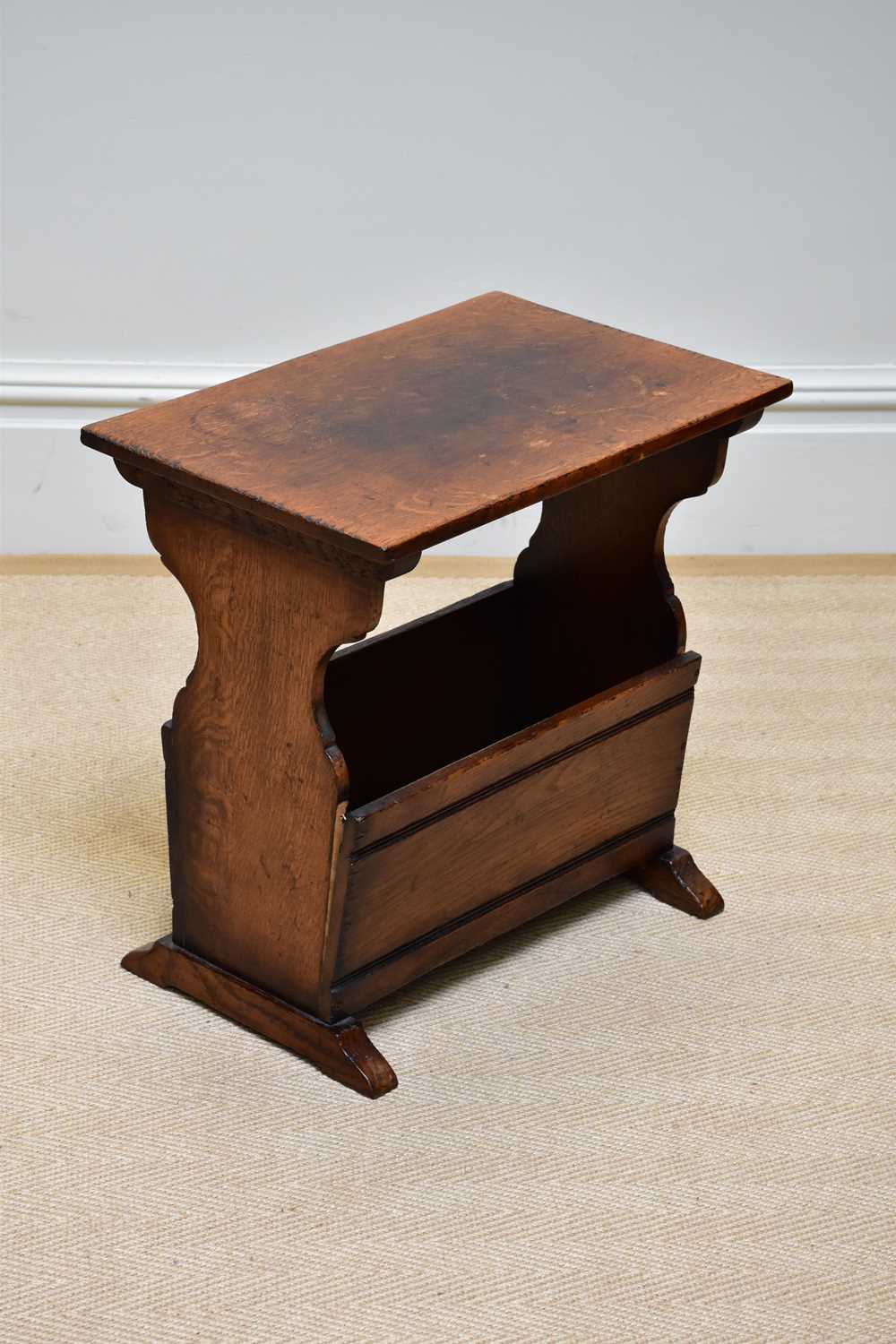 A reproduction oak magazine rack/coffee table, width 51cm, height 50cm.