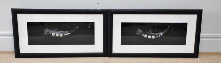 A pair of white metal mounted bone inlaid opium pipes, both framed and glazed, 89 x 48cm.
