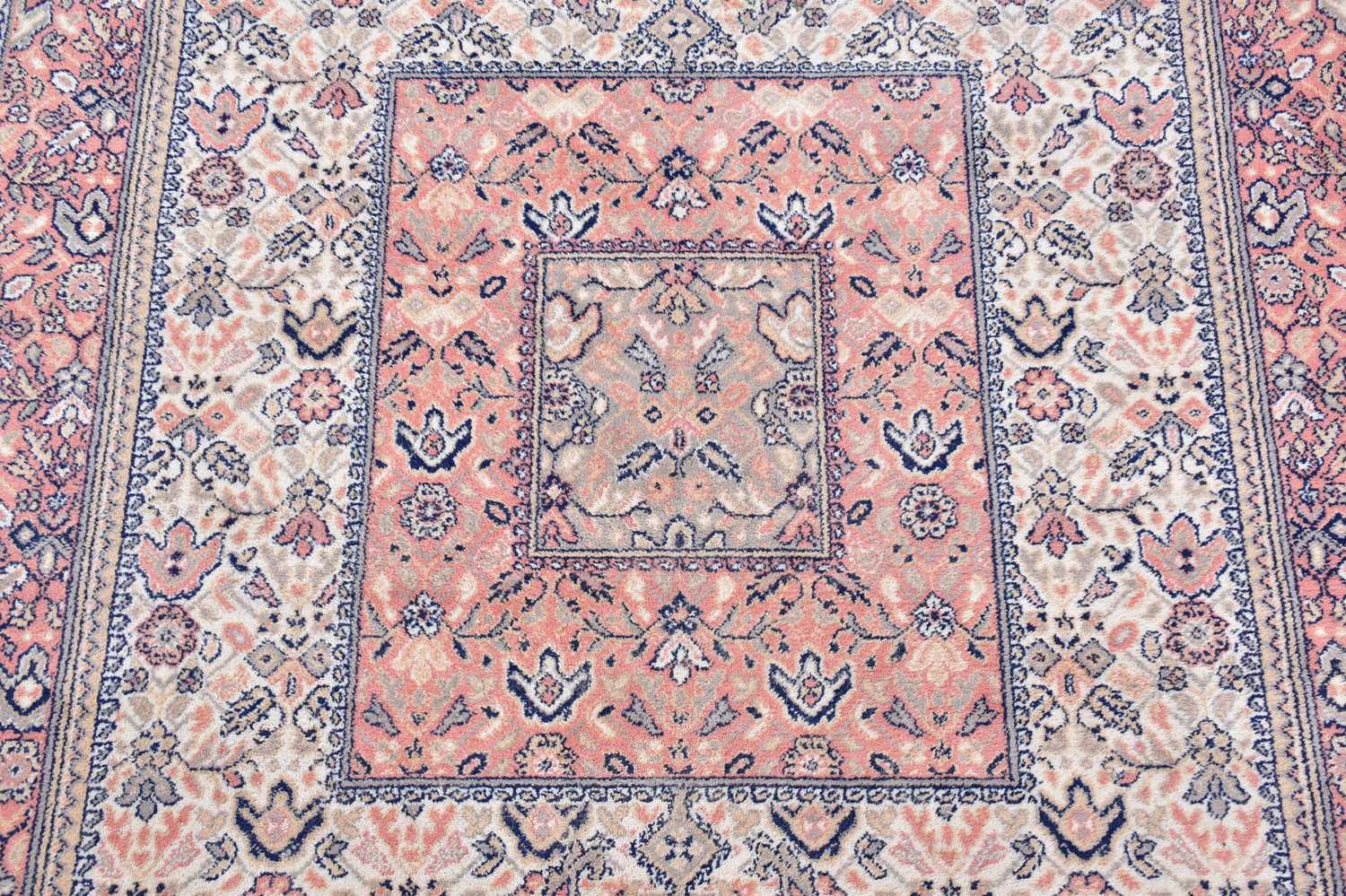 A Super Keshan rug with floral decoration on a salmon pink ground, 240 x 170cm. - Image 2 of 3