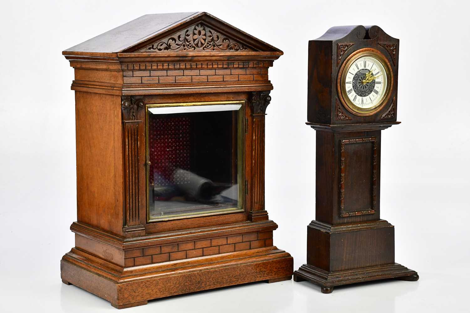 An oak cased miniature longcase clock, the dial set with Roman numerals, height 38cm, and an early