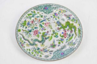 A 19th century Chinese Famille Verte plate painted with five claw dragons, diameter 23cm.