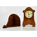 An Edwardian inlaid mahogany mantel clock with dial set with Arabic numerals, height 26cm, and a