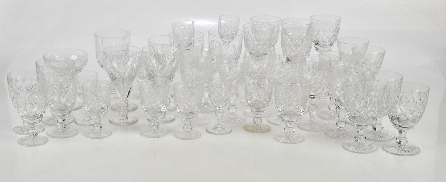 TUDOR; a part suite of twenty-two drinking glasses including five white wine glasses, height 18cm,
