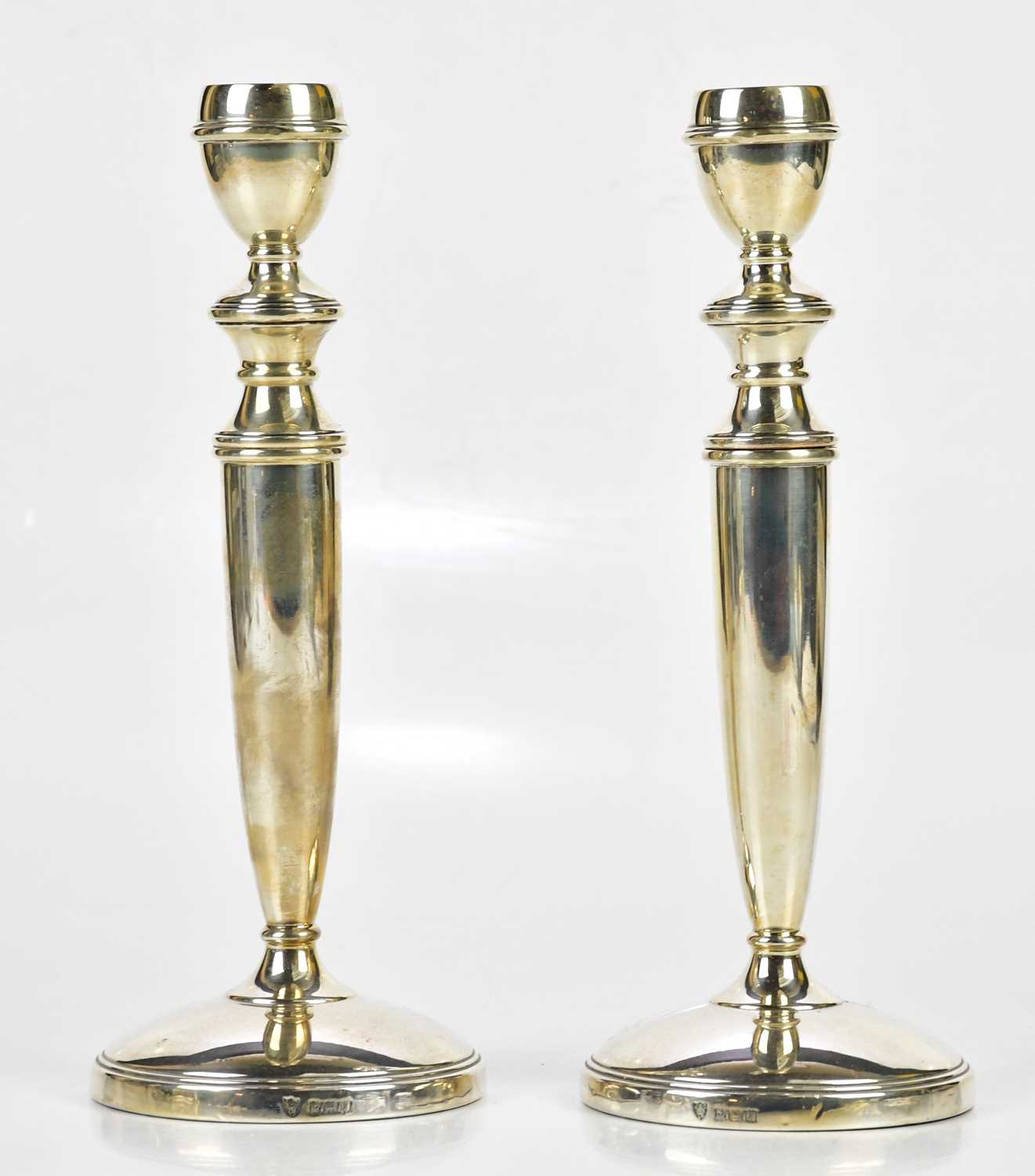 J B CHATTERLEY & SONS; a pair of Elizabeth II hallmarked silver candlesticks, with screw out top