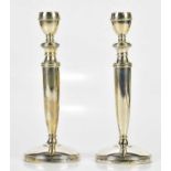 J B CHATTERLEY & SONS; a pair of Elizabeth II hallmarked silver candlesticks, with screw out top