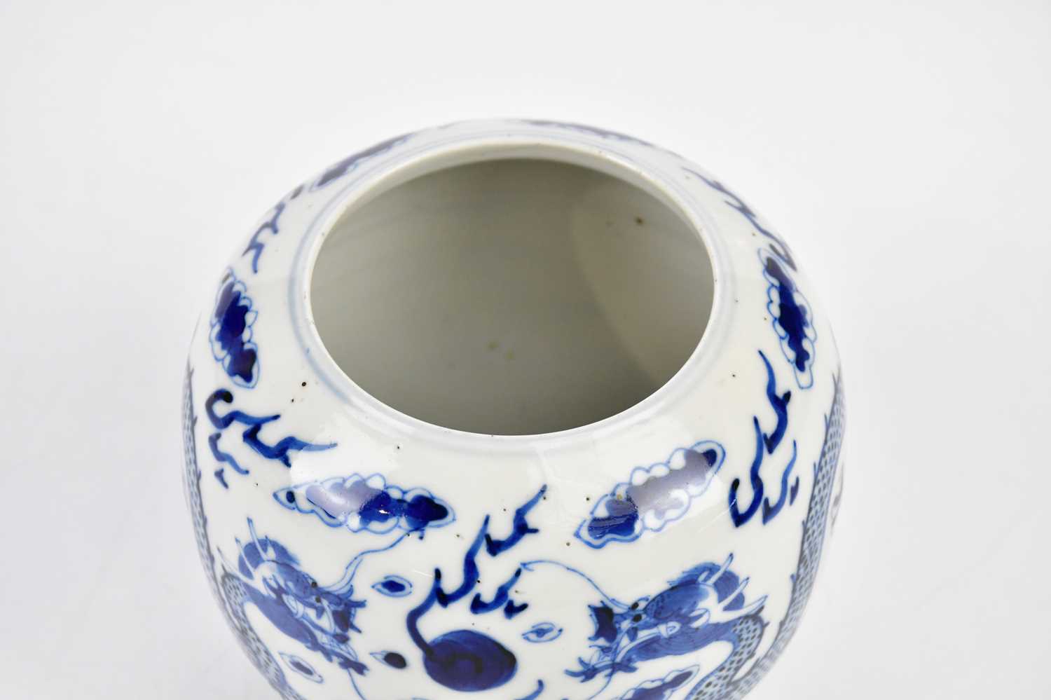 A late 19th century Chinese blue and white globular vase, decorated with a four claw dragons chasing - Image 5 of 7