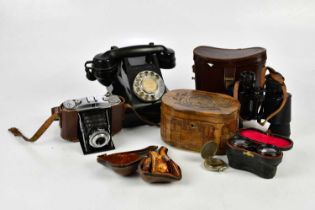 An assortment of collectors' items including a vintage bakelite telephone, a carved olive wood tea