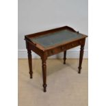 A 19th century mahogany two drawer writing table with turned tapering legs, height 82cm, width 92cm,