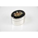 A Continental white metal pill box, the lid set with a micro-mosaic decorated depicting a hen and
