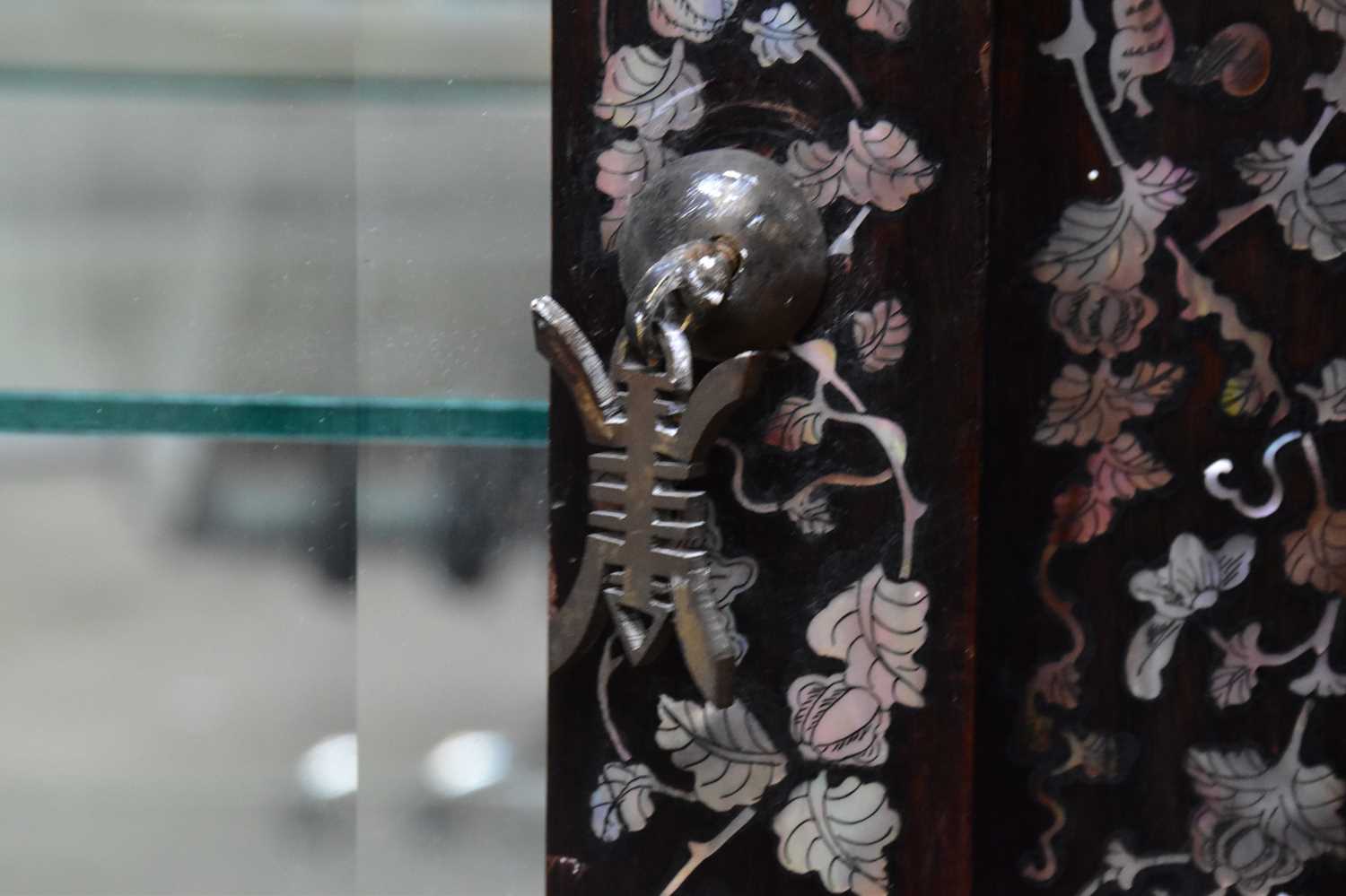 A Chinese ebonised carved display cabinet with mother of pearl inlaid decoration depicting - Image 9 of 13