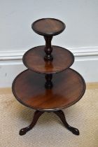 A 20th century mahogany miniature three tier dumb waiter, height 53cm.