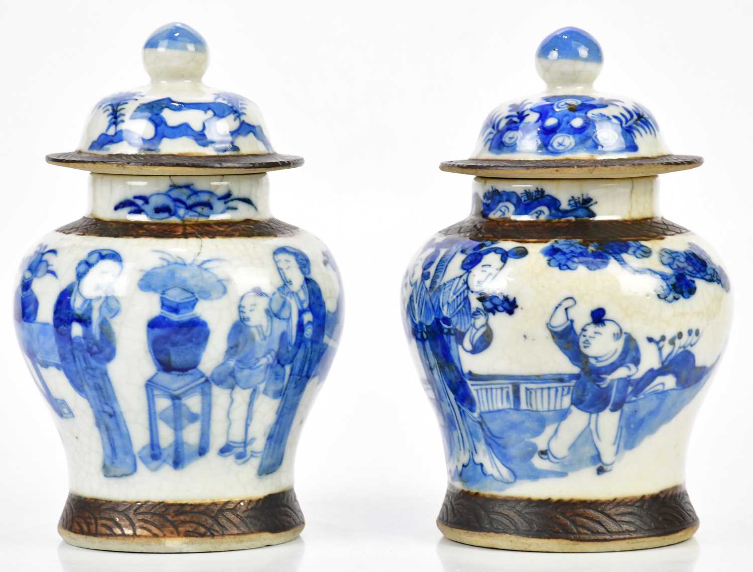 A pair of Chinese blue and white crackle glazed ginger jars and covers, with four character Kangxi