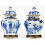 A pair of Chinese blue and white crackle glazed ginger jars and covers, with four character Kangxi