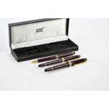 MONTBLANC; a set of three Meisterstuck burgundy pens including a cartridge fountain pen with 14K