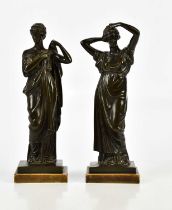 A pair of 19th century bronze figures representing classical females with flowing dresses, on plinth