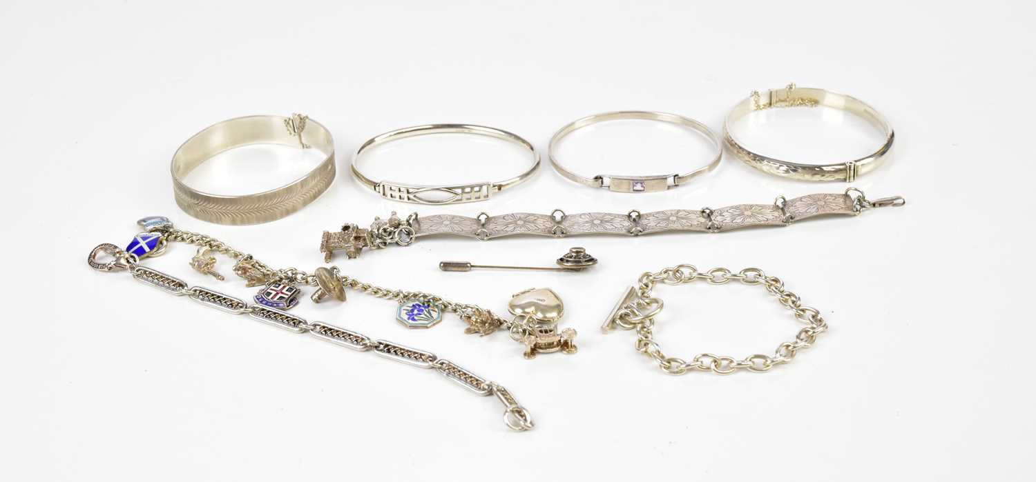 A small quantity of silver jewellery to include bracelets, bangles and a pin.