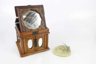 An Eastern metal bound pine jewellery cabinet, the hinged top enclosing mirror above two mirrored