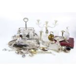 A collection of silver plate including a twin handled candelabrum with glass drips trays, a cruet,