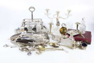 A collection of silver plate including a twin handled candelabrum with glass drips trays, a cruet,