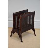 An early 20th century carved Canterbury with cane work sides.