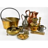 A collection of 19th century and later metalware including a large copper jug, brass jam pan, oil