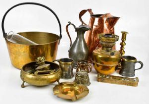 A collection of 19th century and later metalware including a large copper jug, brass jam pan, oil