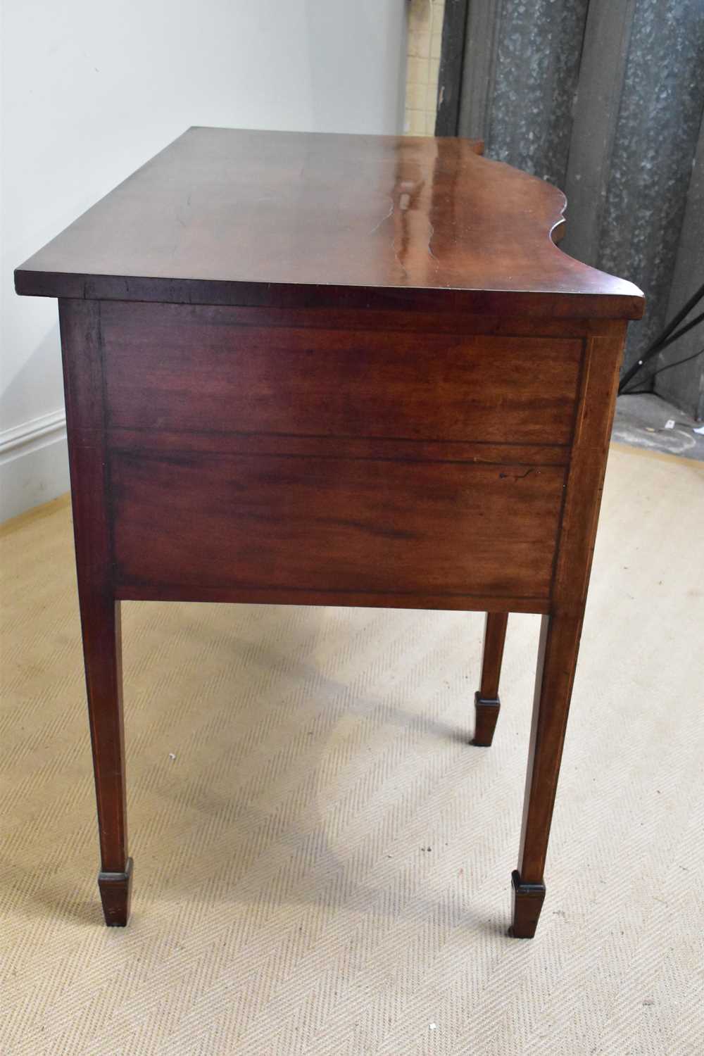 A late George III serpentine mahogany sideboard with three short drawers and one deep drawer on - Image 4 of 4