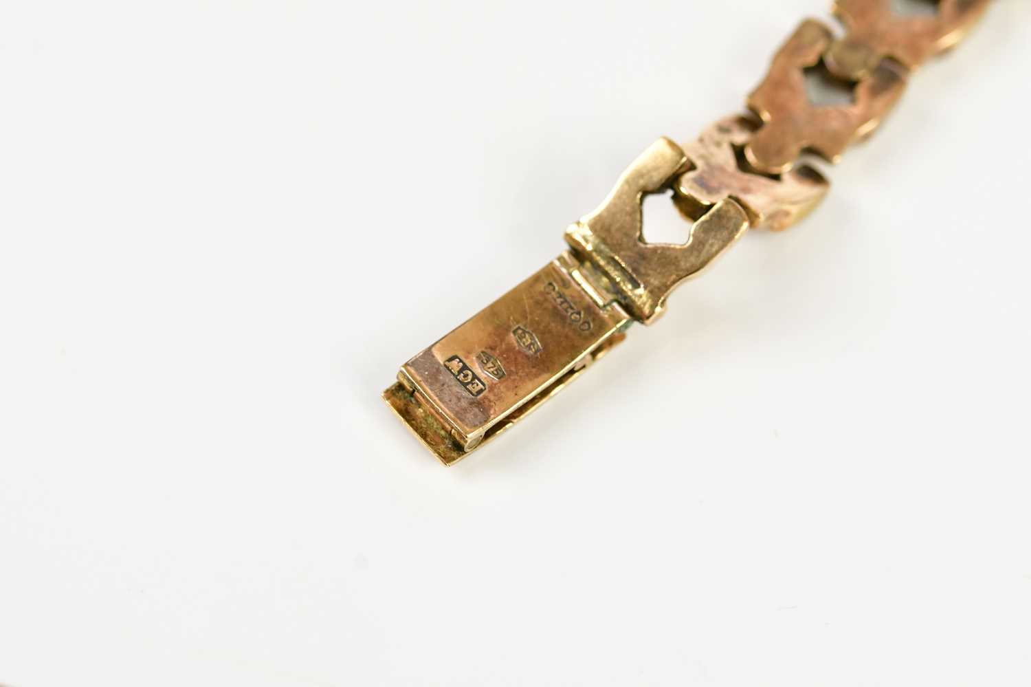 ENIGAR; a 9ct gold lady's wristwatch, set with batons, on 9ct gold textured strap, total weight - Image 5 of 5