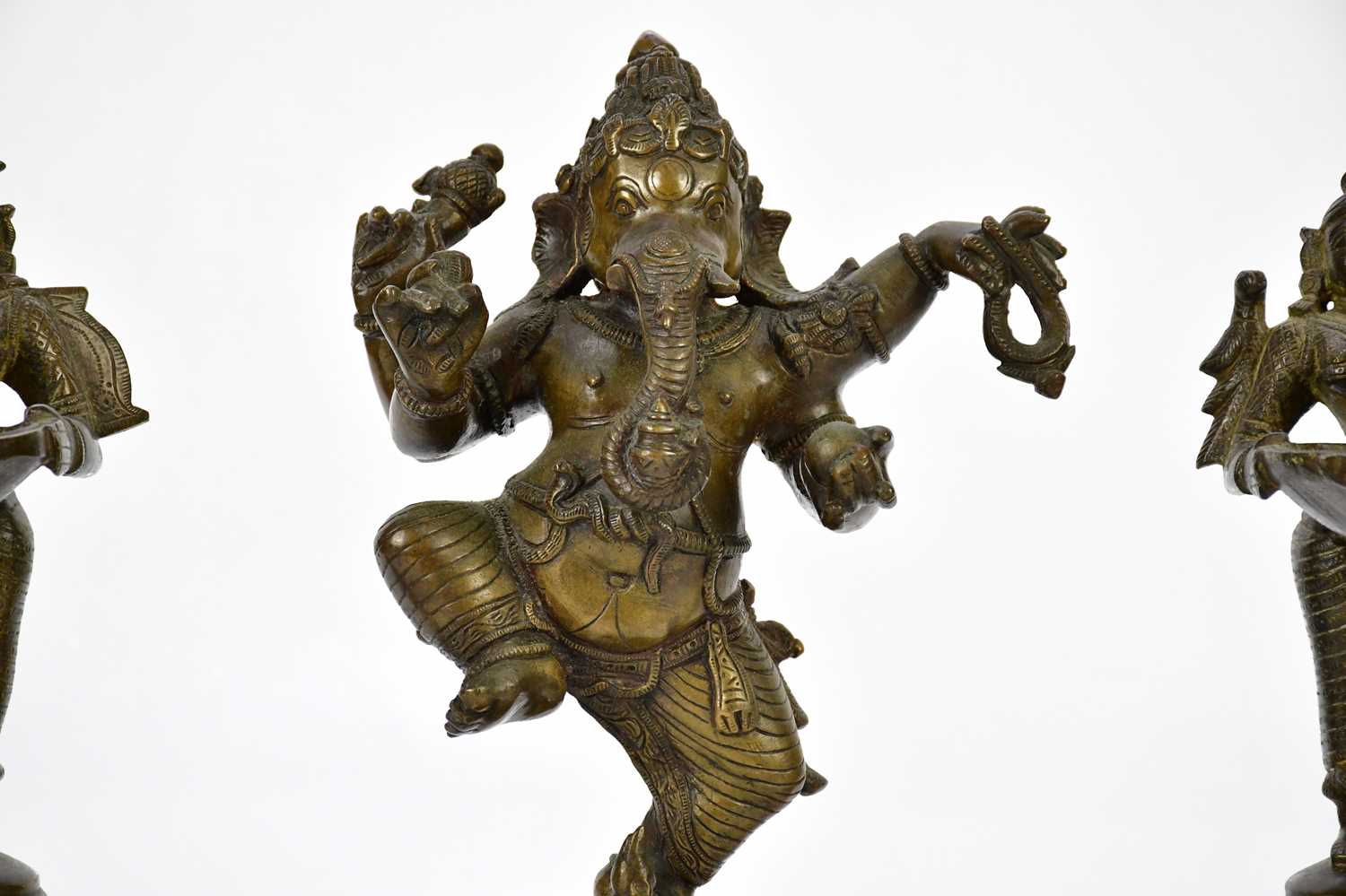 A bronze figure of Ganesh, together with a pair of bronze wick lamps, height of largest 29cm. - Image 2 of 8