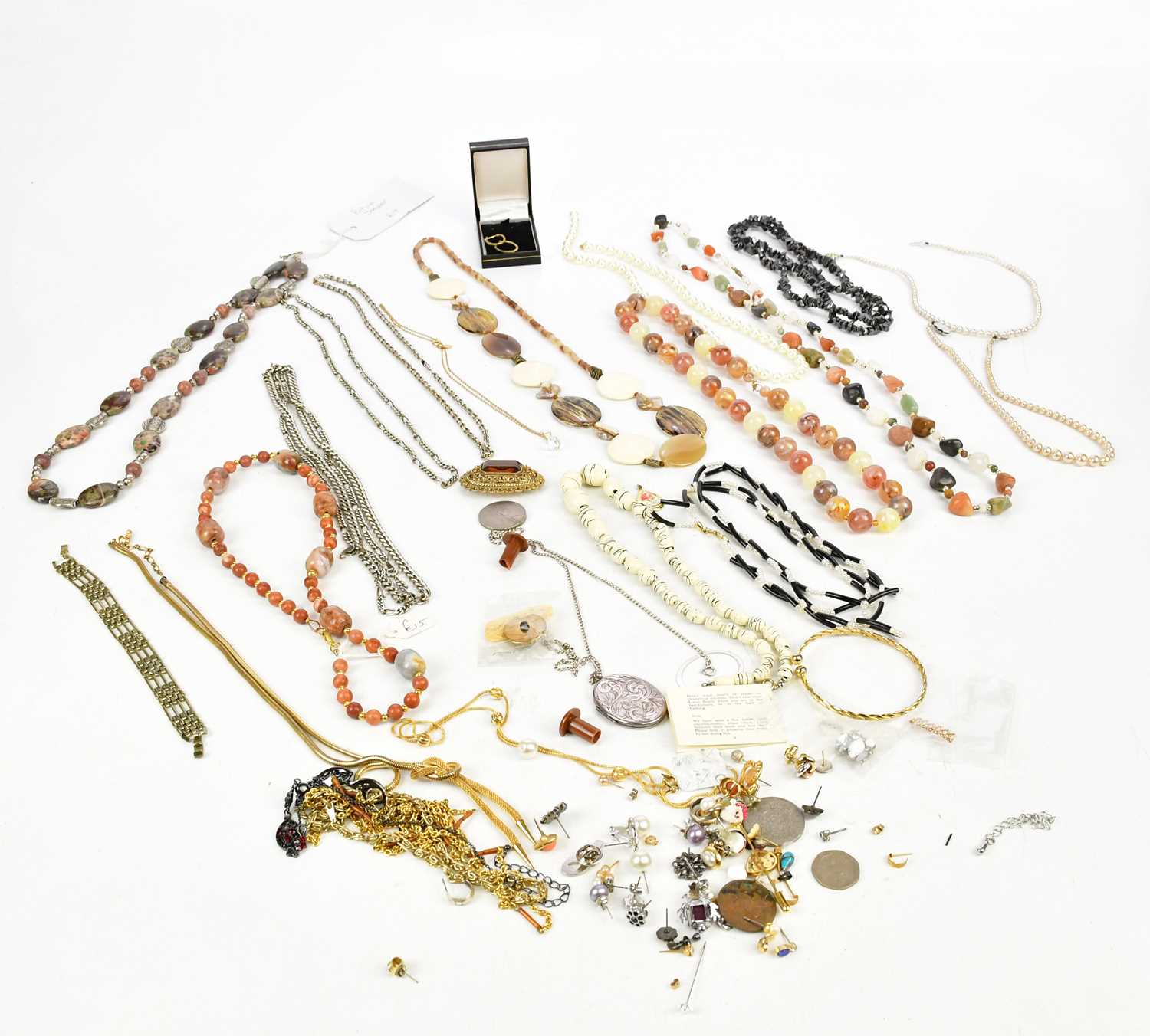 A small collection of costume jewellery including bead necklaces, earrings and ear studs, brooch,