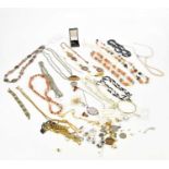 A small collection of costume jewellery including bead necklaces, earrings and ear studs, brooch,