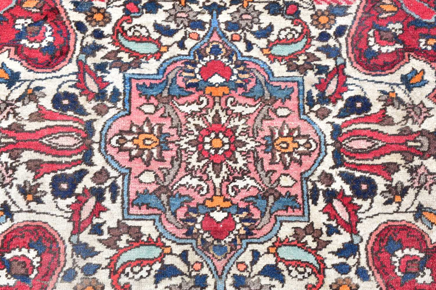 A red ground wool carpet with geometric central design, 224 x 140cm. - Image 3 of 3