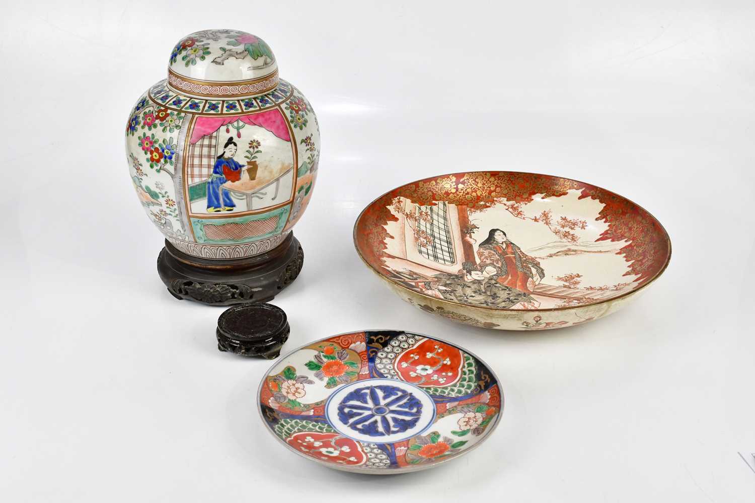 A Chinese Famille Rose ginger jar and cover, decorated in panels with figures and children, height